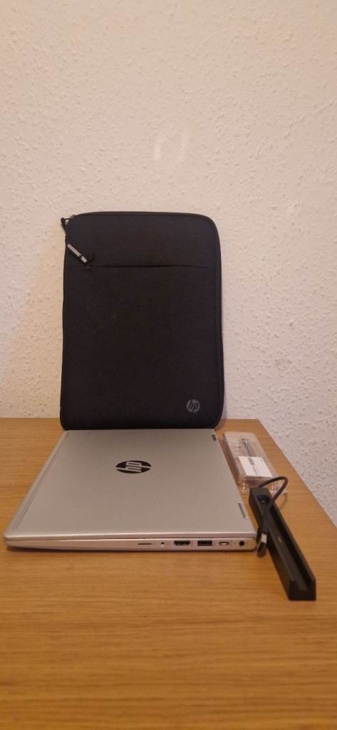 HP ProBook touchscreen laptop with pencil and laptop sleeve 