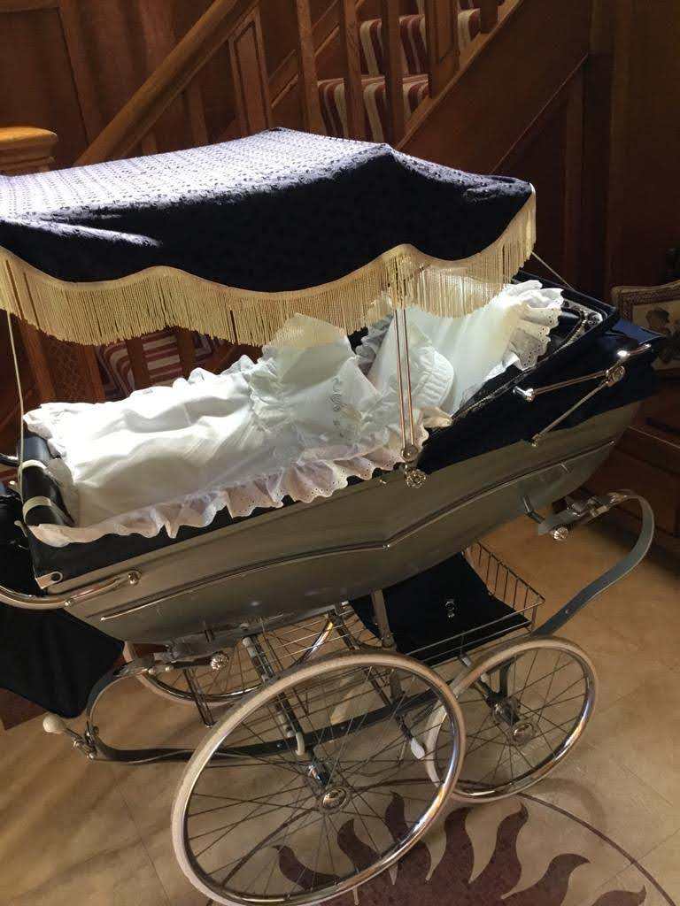 Vintage restored Silvercross pram with toddler seat, sun canopy nursing bag and accessories.