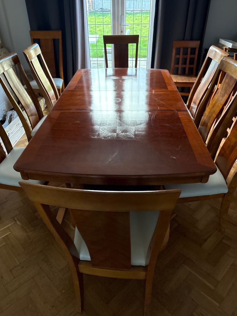 Solid extendable dining table and x 10 chairs 