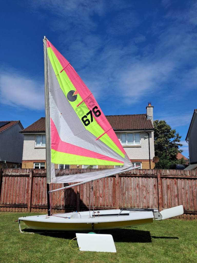 Small Sailing Dinghy with Bright Sails – Good Condition