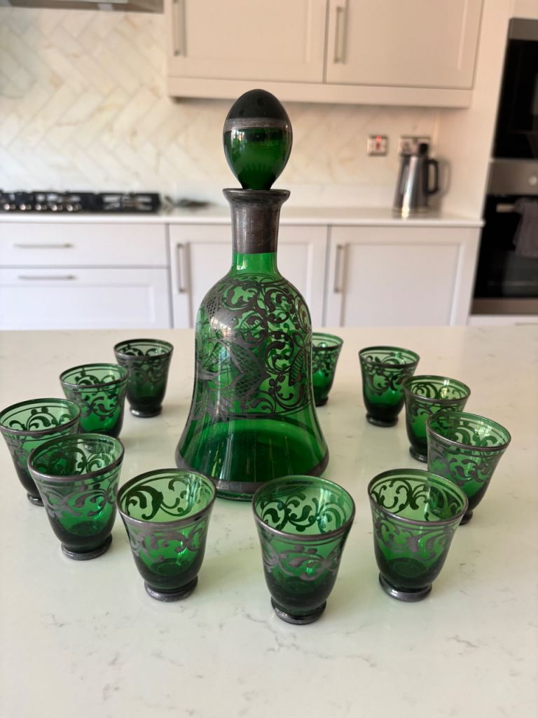 Green glass decanter with 12 small glasses