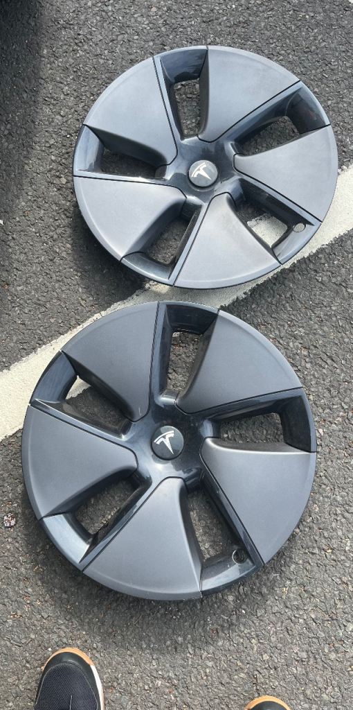 Two Tesla wheel trims 