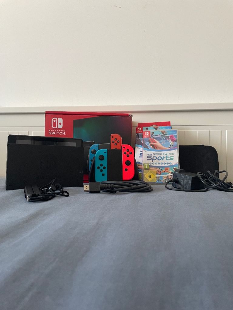 Nintendo Switch Console with Accessories and Games – Good Condition