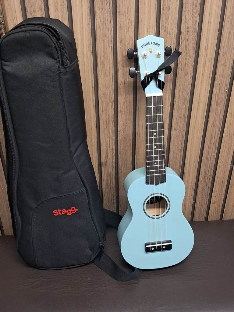 Traditionally Handcrafted  Soprano Ukulele with case.Light blue color.( PURETONE).