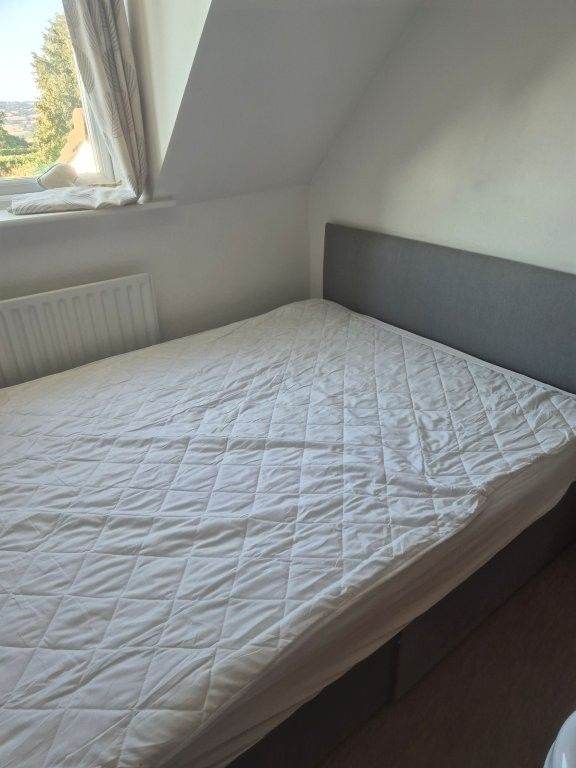 Double Bed with Grey Fabric Headboard and Mattress