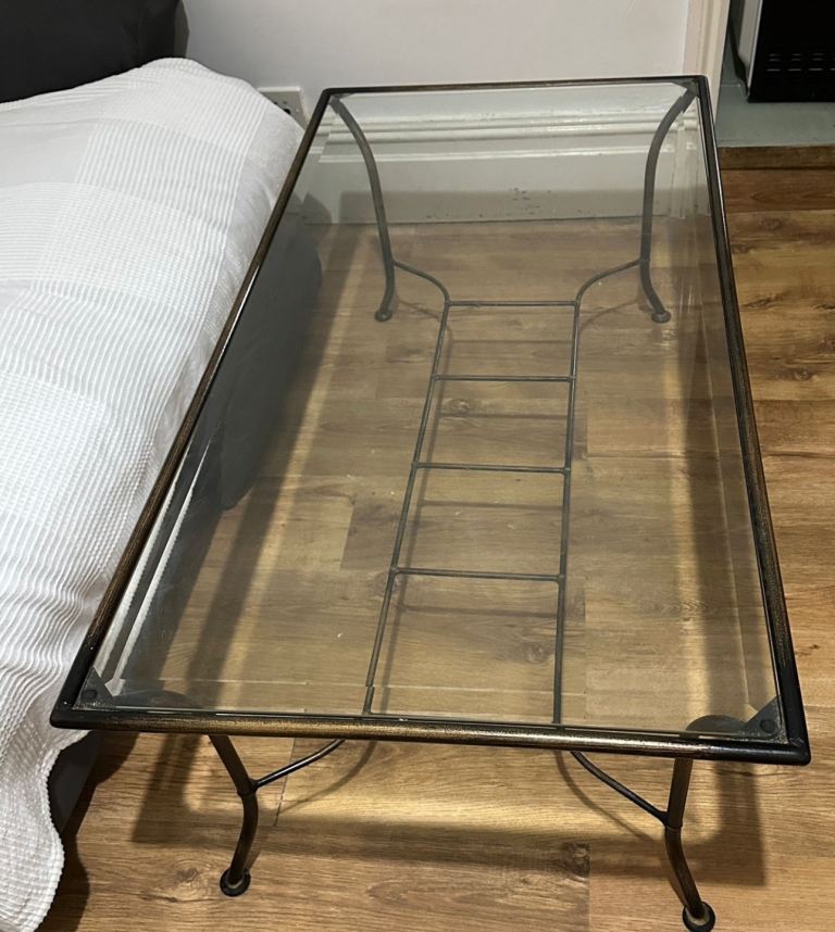 Glass table with metal frame