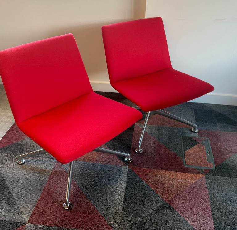 Pair of Bright Red Fabric Chairs with Chrome Bases and Round White Table