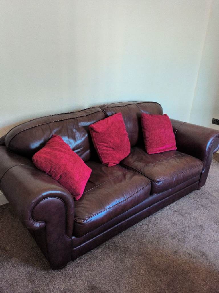 Comfy Brown Leather Two-Seater Sofa – Good Condition and armchair and foot box