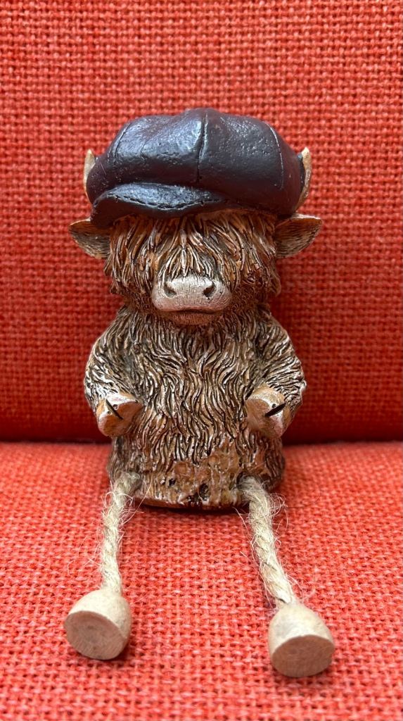 Cute Highland Cow Figurine with Flat Cap and Dangly Legs