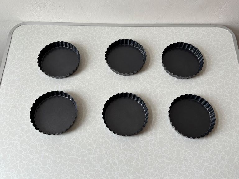 6-piece set of 5-inch quiche pans with removable bottoms.