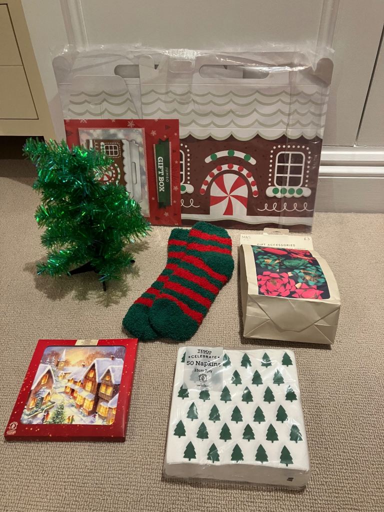 Christmas socks, small tree, bows/ribbons, cards, napkins, gingerbread house gift box. £10