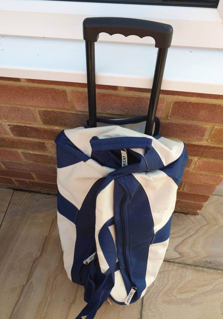 Blue and White Wheeled Duffle Bag – Good Condition