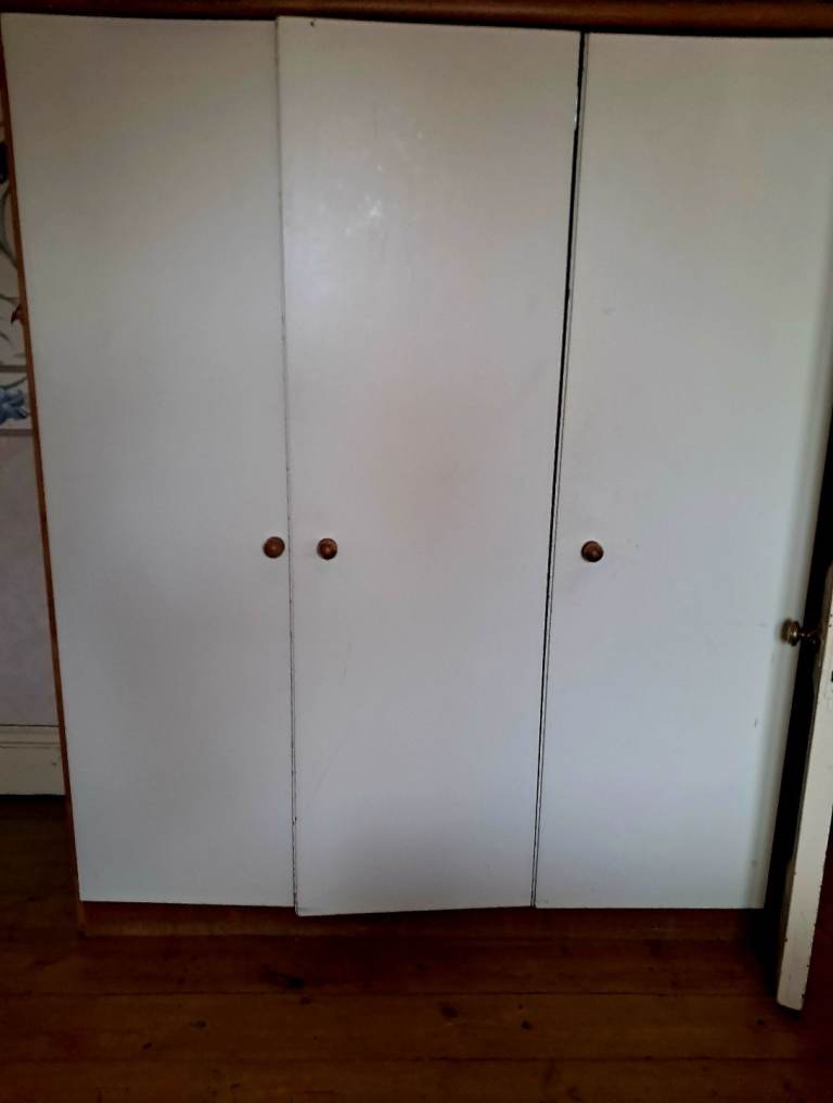Triple wardrobe with storage shelves