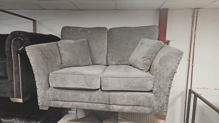 Grey Two-Seater Sofa with Studded Arms – Good Condition