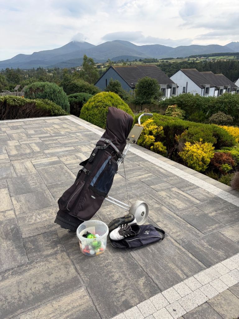 Golf bag, clubs, trolley, balls and shoes