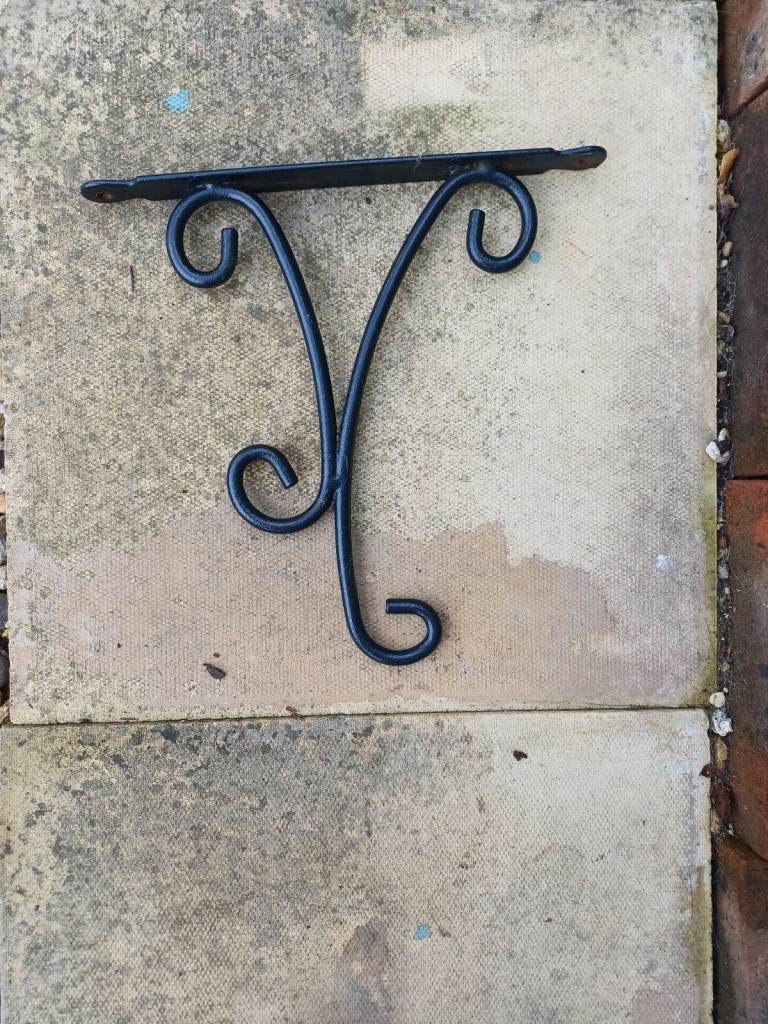 Ornate hanging basket brackets 