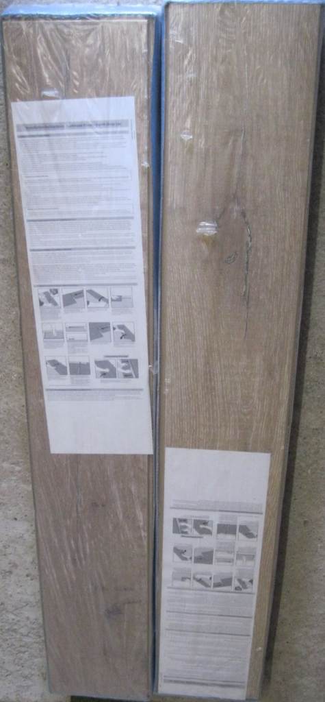 Two NEW and still sealed packs of Laminate Flooring by Dezign