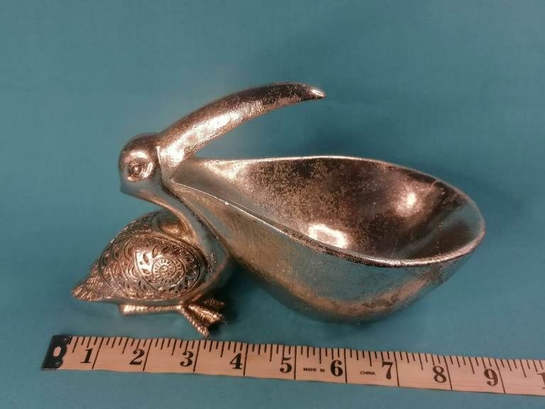 Pre- owned. Good condition. Resin Pelican Statue, Key Phone Holder,