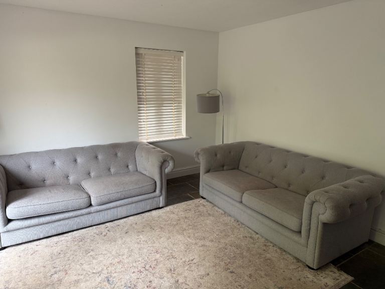 2 x grey sofas