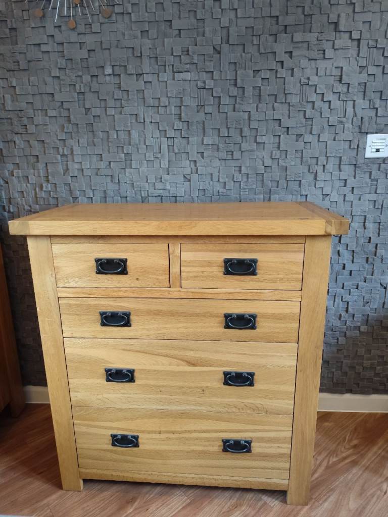 Oak 2 over 3 Chest of Drawers with rustic metal drop handles.