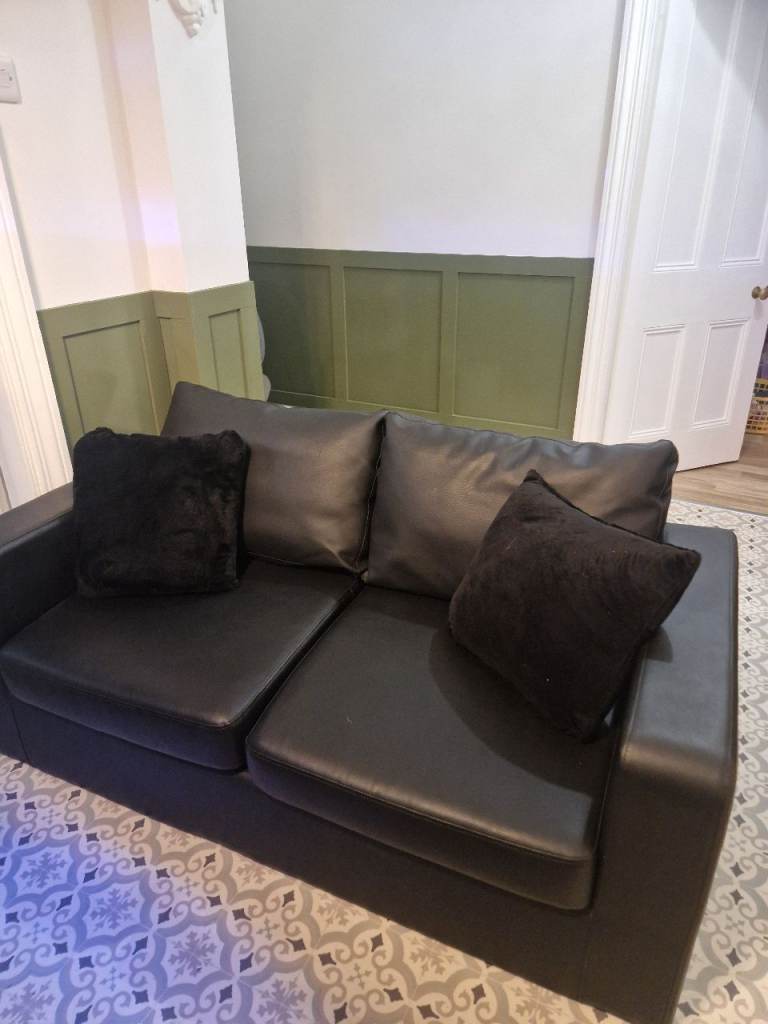 Black leather look sofa bed 