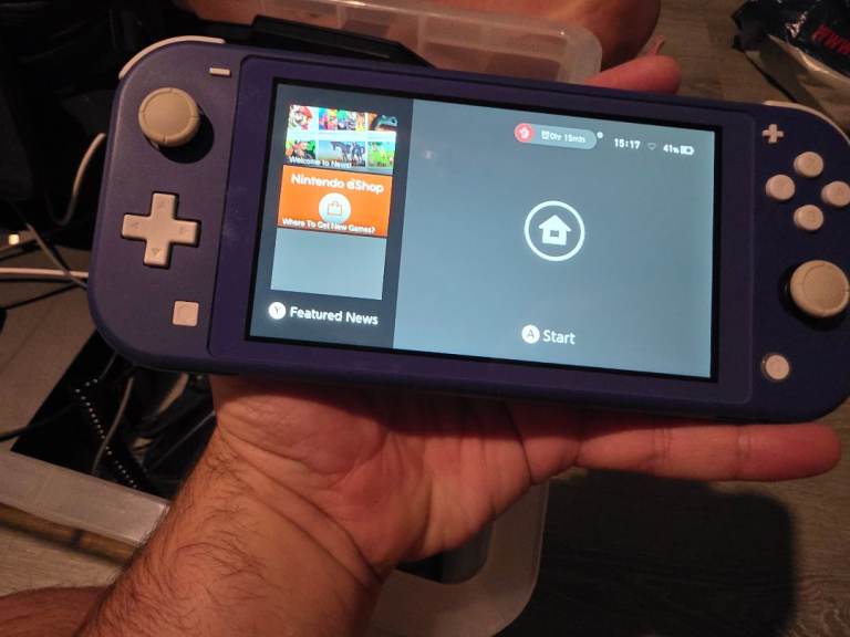Nintendo Switch Lite (Purple) with Games and Case