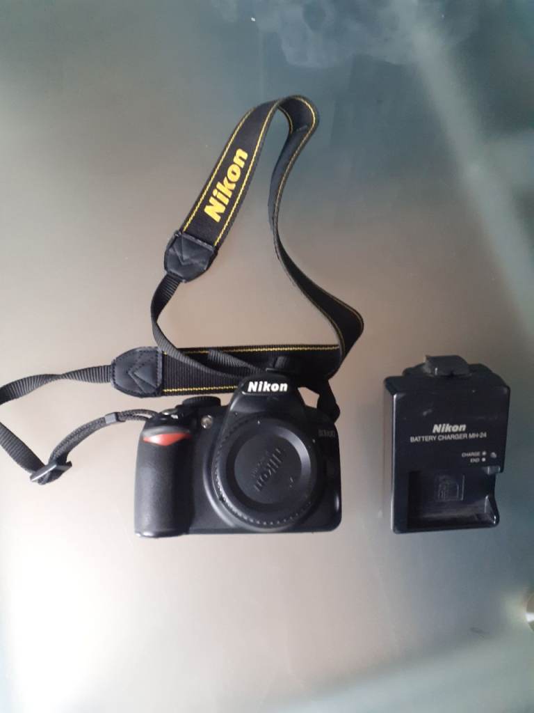 Nikon D3100 DSLR Camera (body only) with original Nikon Strap and Charger