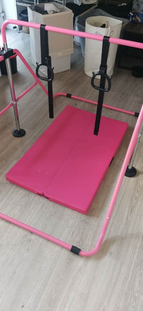 Kids gymnastic bar with mat