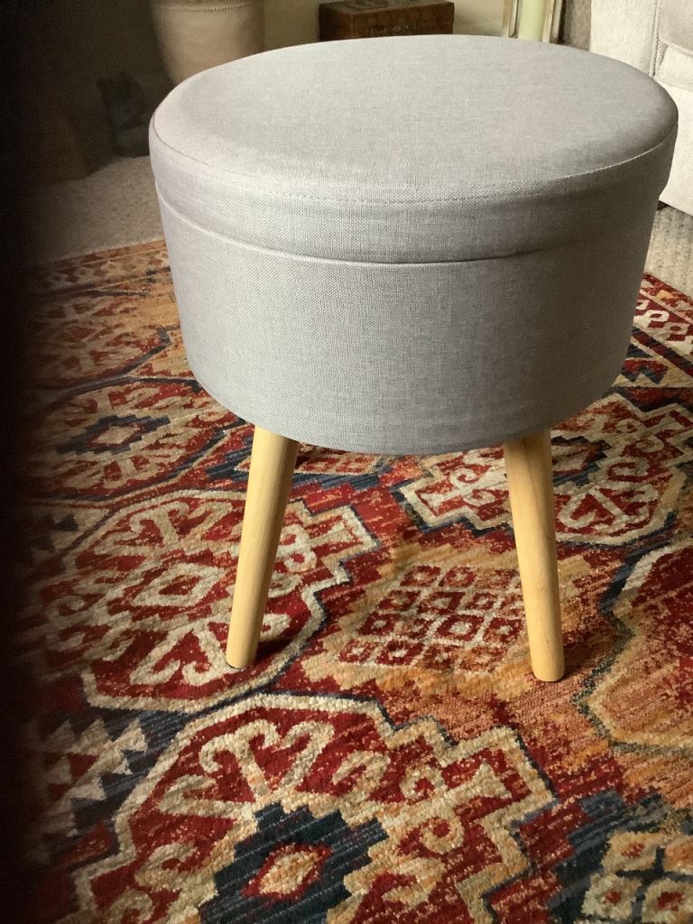 Grey stool measuring 17ins in height with storage.