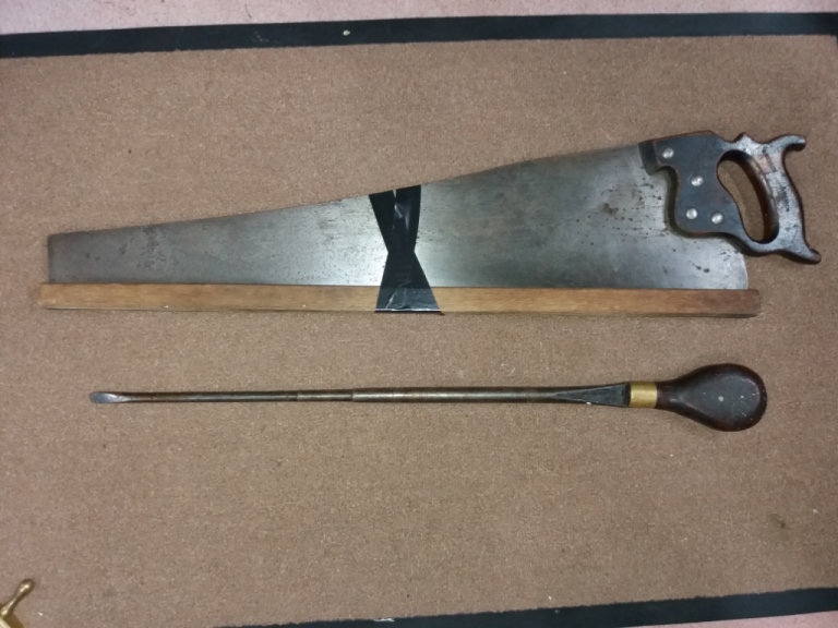 Old saw and screw driver.