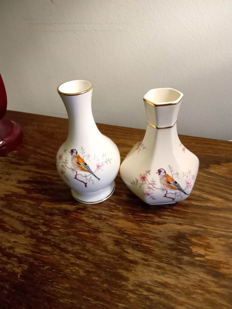 Pair of decorative bird and floral bud vases