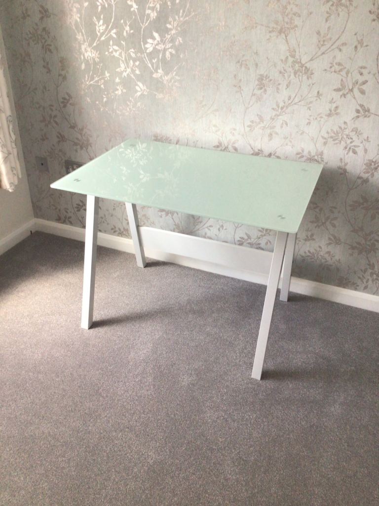White computer table - Metal legs and glass topped.