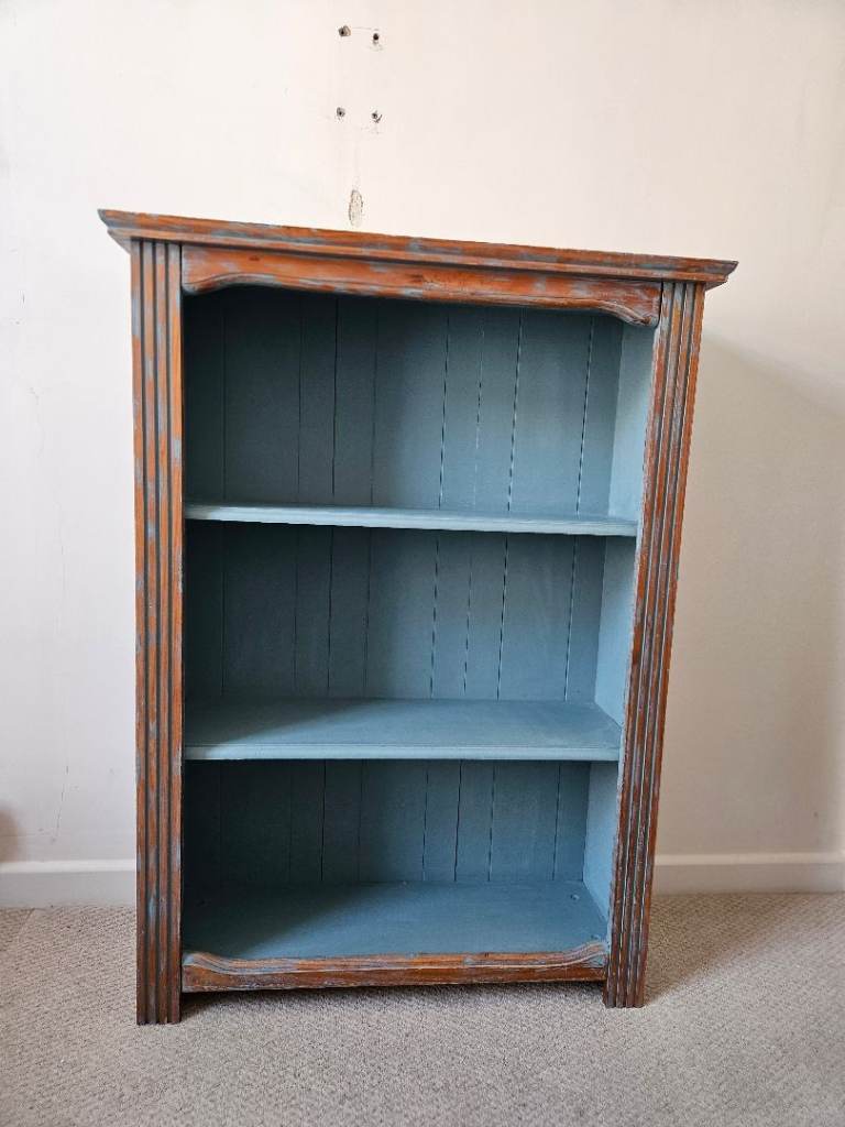 Wooden Bookcase with Blue Interior – Good Condition