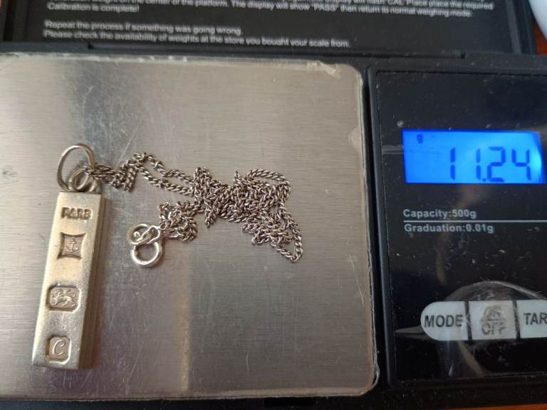 £45 sterling silver necklace with ignot pendant 
