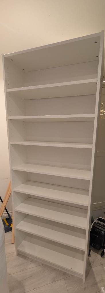 Tall white bookshelf in good condition 