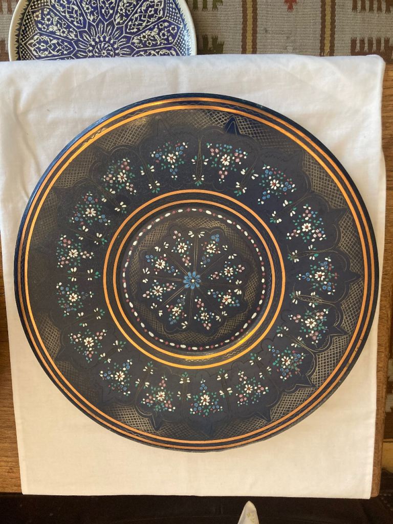 Large dark navy enamel-style decorative plate