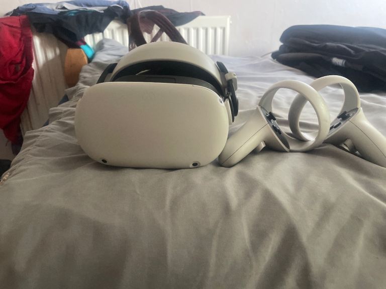 Meta Quest 2 VR Headset with Controllers  also has a extended battery on the top 
