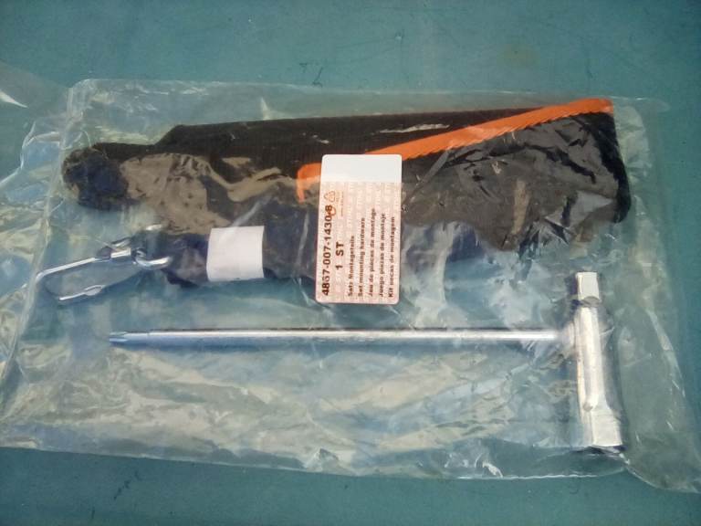 Stihl shoulder strap and box spanner.