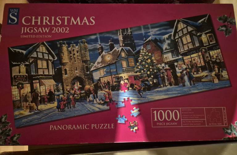 New sealed 1000 piece Gibsons Christmas jigsaw puzzle and two other opened Christmas puzzles