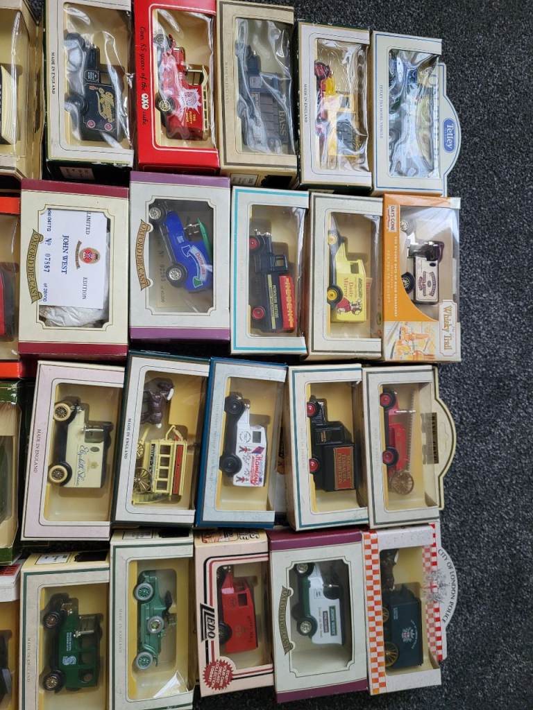33 collectible toy delivery vans, trucks, horse drawn carts 