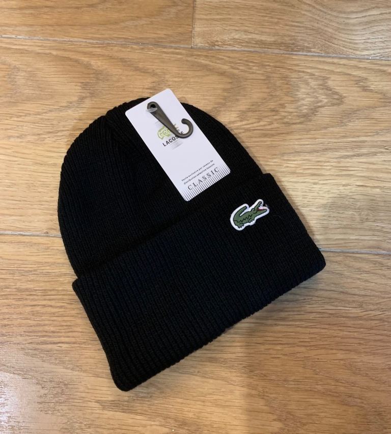 Lacoste beanie new with tags available in black and white 