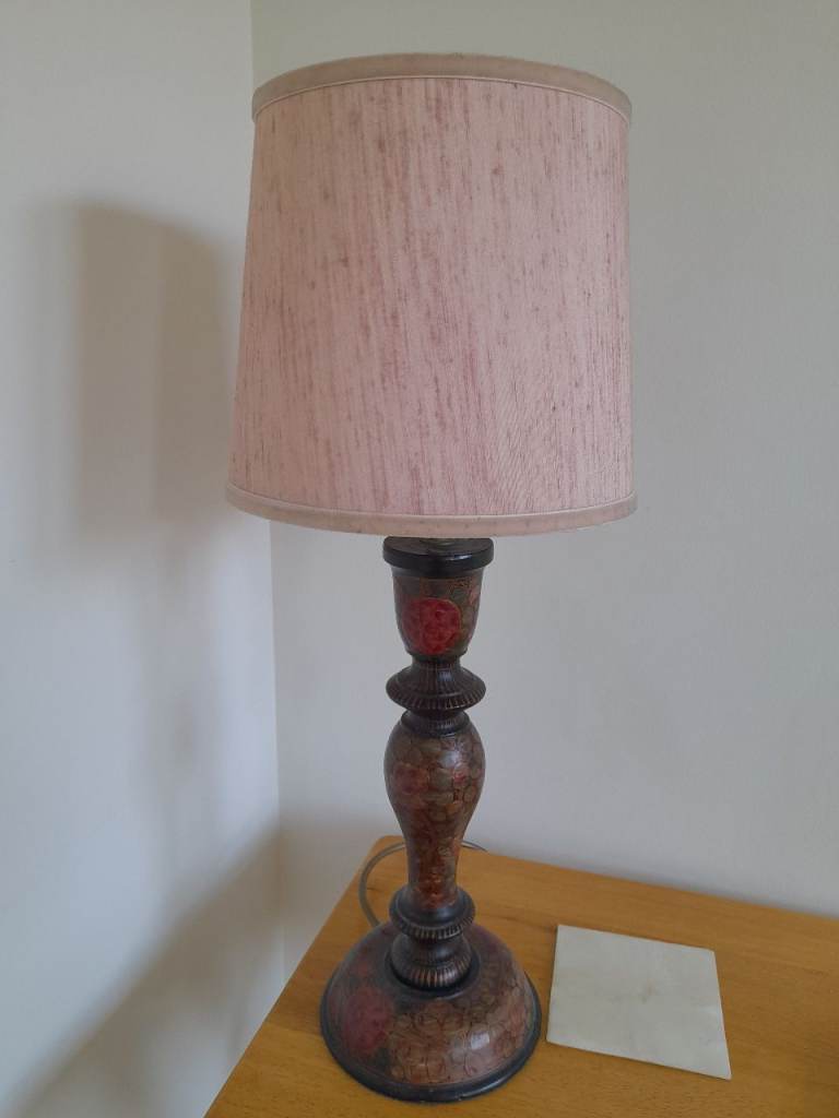 Floral painted and laquered wooden turned lamp with pink shade