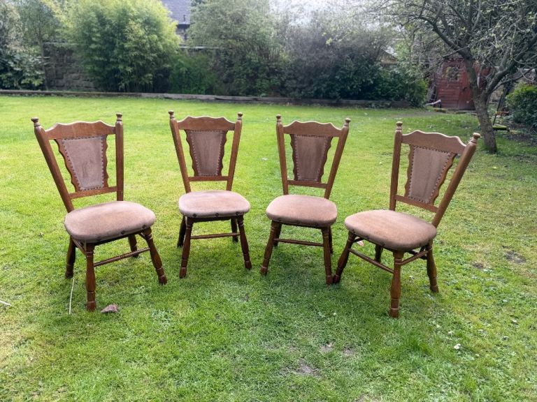 Four heavy studded dining chairs