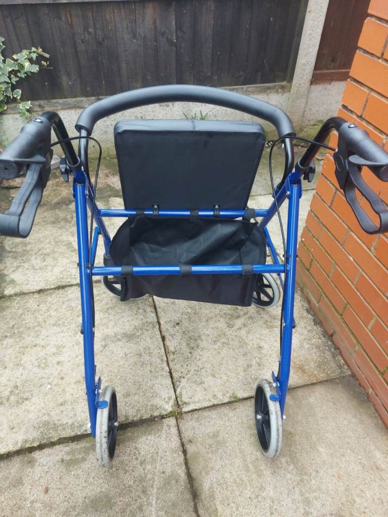 Fold up walker with seat