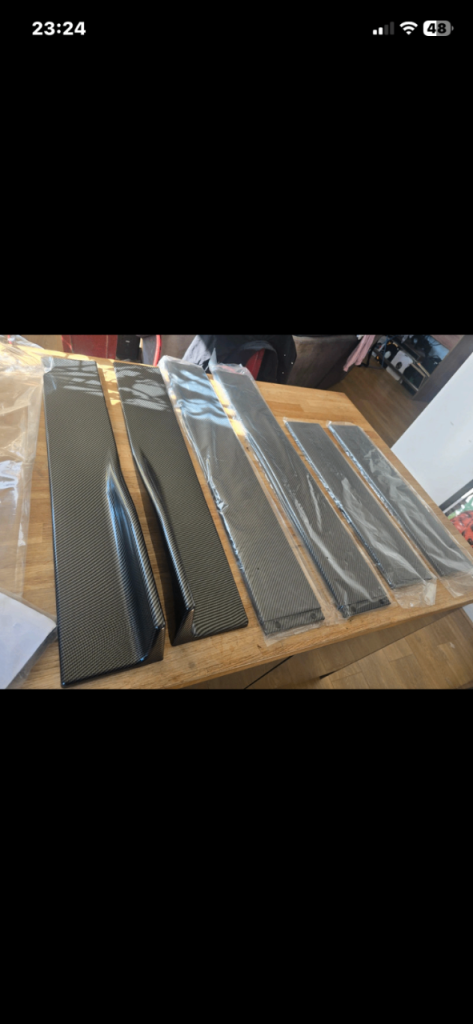 Universal carbon look side skirts