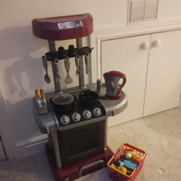 Child’s play kitchen with accessories 