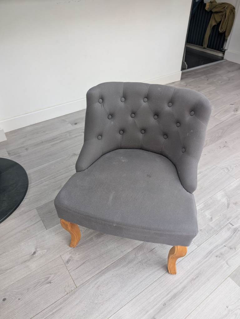 Grey button back tub chair