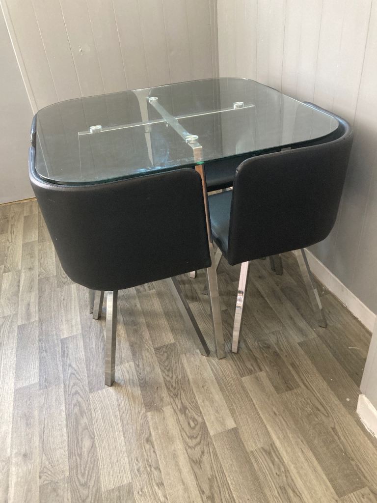 Compact Glass Dining Table with 4 Black Chairs – Good Condition