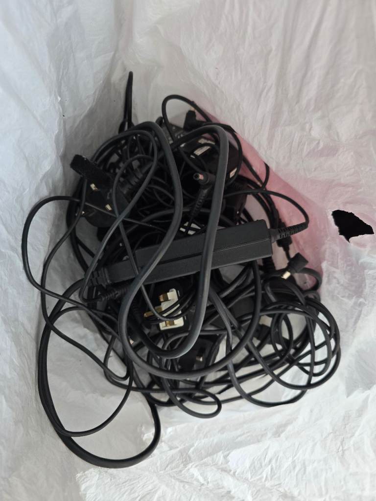 Bag of Various Cables and laptop Chargers