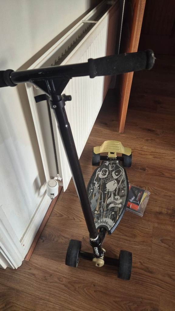 Black and Yellow Skateboard with Handle – Good Condition